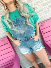 Load image into Gallery viewer, Medium wash distressed overalls
